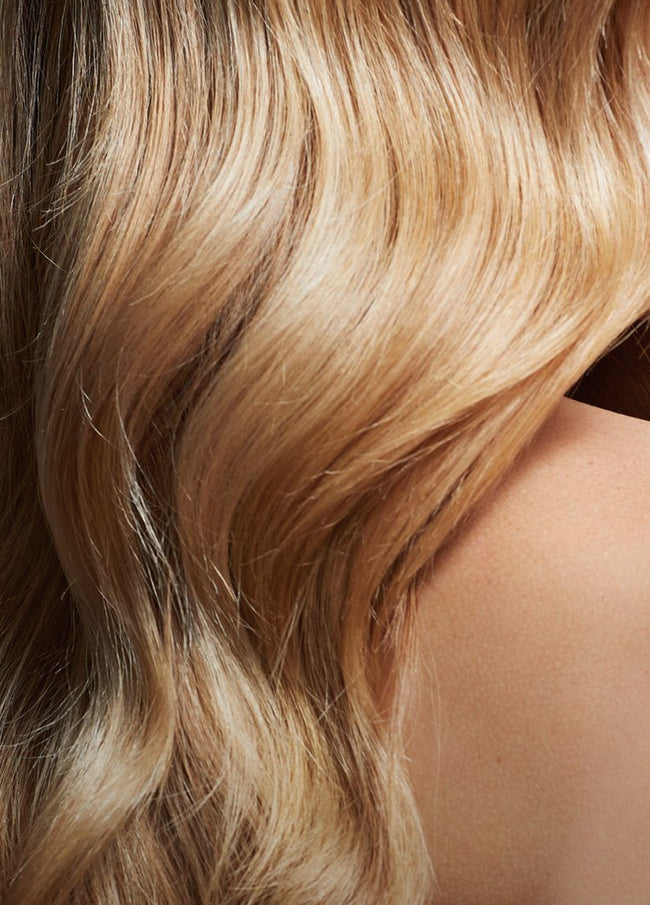 Glossy blonde waves from the Eufora hair care campaign